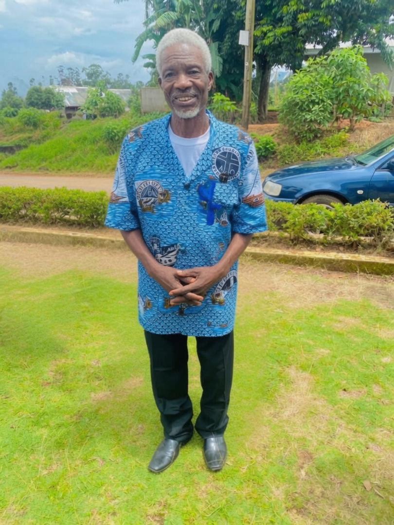 Pa Ndambi Paul Angemba in traditional blue attire